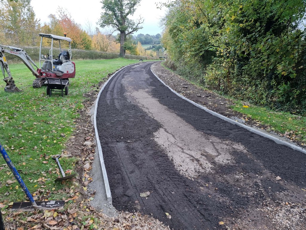 This is a large driveway which is in the process of having a tar and chip driveway installed on by New Romney Driveways