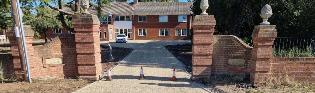 This is a photo of a newly installed chip and tar driveway, installed by New Romney Driveways