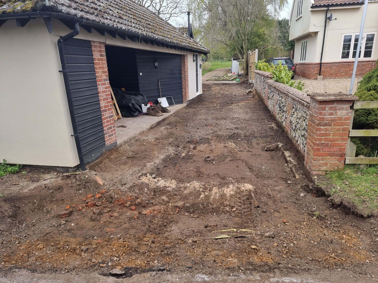 This is a tarmac driveway that is in the process of being dug out and installed by New Romney Driveways